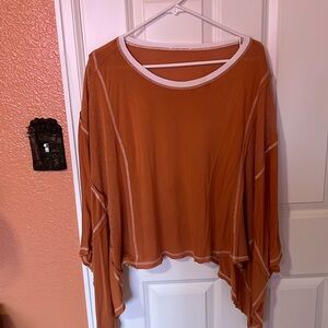 Orange lightweight poncho - tags cut off because they itched - size Large